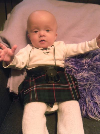 baby kilts Connor in his kilt