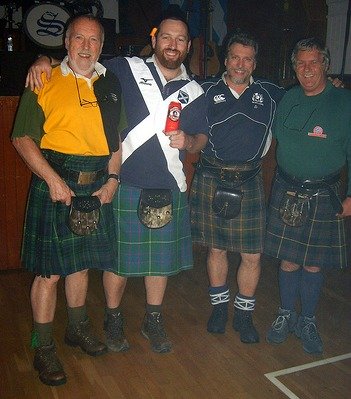 men wearing kilts