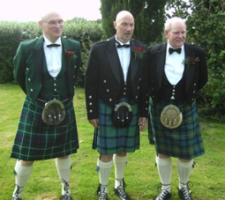 men wearing kilts