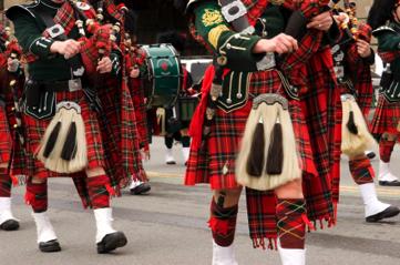 Military pipe band wearing authentic Scottish kilt